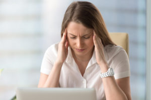 Woman with migraine headache