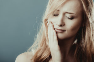 Woman with jaw pain